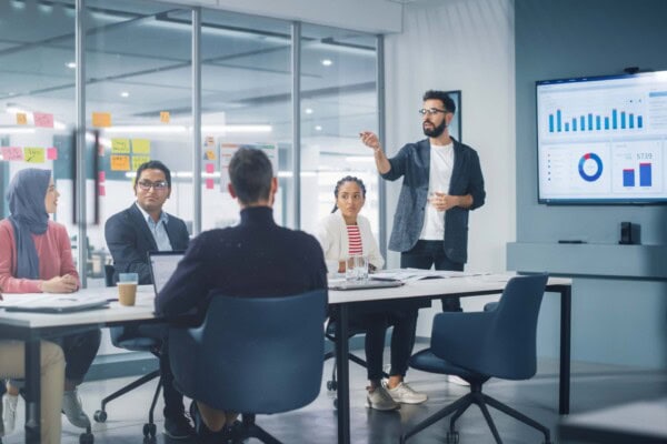 Team meeting about customer insights systems vs. goals