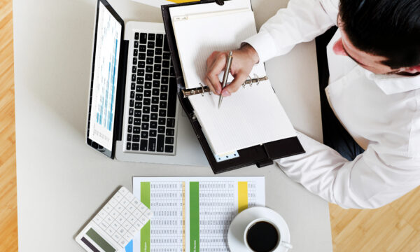 Businessman in office taking notes