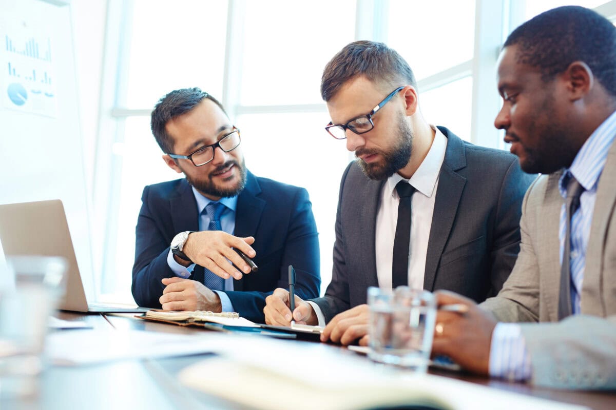 Multi-ethnic group of businessmen discussing