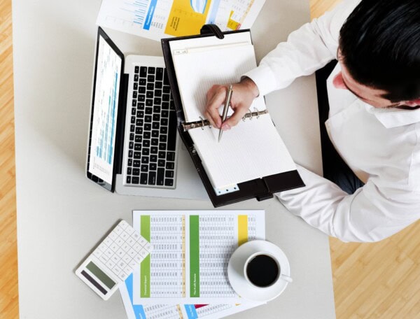 businessman in office taking notes